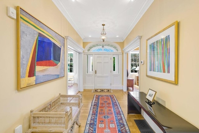 26 Winter St, Salem, MA 01970 - entryway with ornamental molding, wood finished floors, and plenty of natural light