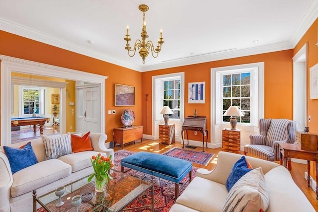26 Winter St, Salem, MA 01970 - living room with wood finished floors, a chandelier, healthy amount of natural light, and ornamental molding