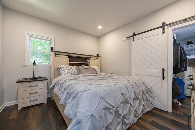 12 Fairmount Ave, Brockton, MA 02301 - bedroom featuring a barn door, a spacious closet, wood finished floors, recessed lighting, and a closet