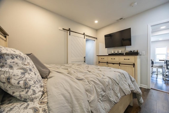 12 Fairmount Ave, Brockton, MA 02301 - bedroom featuring a barn door, dark wood-type flooring, and recessed lighting