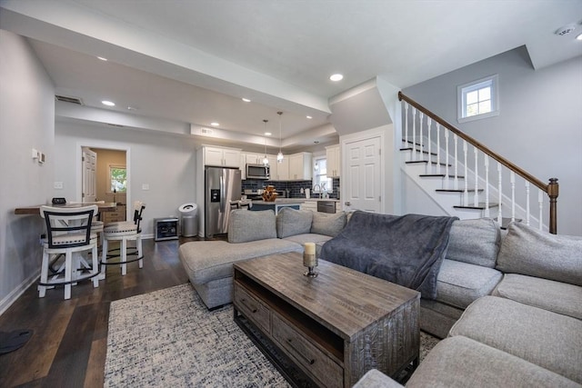 12 Fairmount Ave, Brockton, MA 02301 - living area featuring dark wood-type flooring, stairs, healthy amount of natural light, and recessed lighting