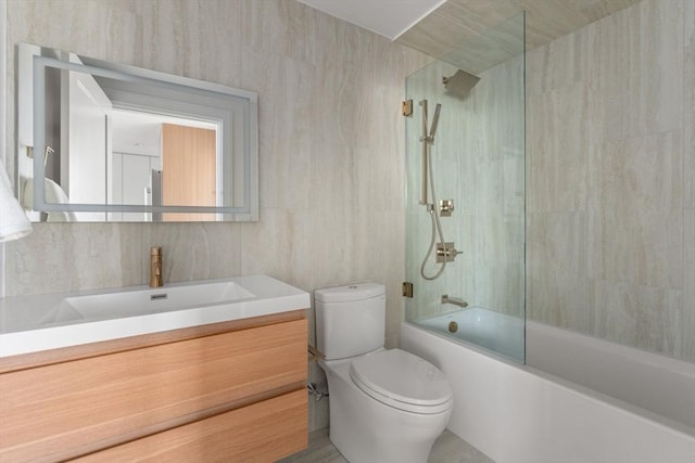 125 Lowell St Unit 3A, Somerville, MA 02143 - bathroom featuring toilet, vanity, and washtub / shower combination