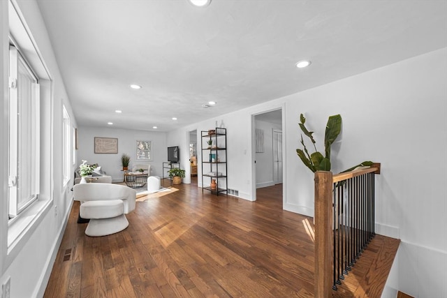 living room featuring dark wood-type flooring