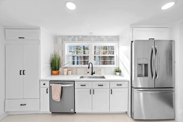 kitchen with white cabinetry, appliances with stainless steel finishes, and sink