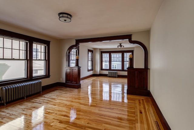 174 Vernon St, Worcester, MA 01610 - spare room with radiator heating unit, light wood-style flooring, and baseboards