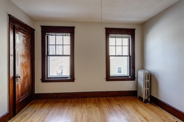 174 Vernon St, Worcester, MA 01610 - unfurnished room featuring radiator heating unit, light wood-type flooring, and baseboards