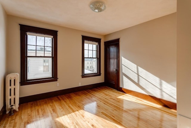 174 Vernon St, Worcester, MA 01610 - spare room featuring radiator, plenty of natural light, and baseboards