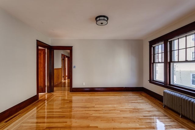 174 Vernon St, Worcester, MA 01610 - unfurnished room featuring radiator, light wood finished floors, and baseboards