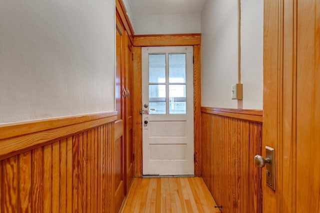 174 Vernon St, Worcester, MA 01610 - doorway with light wood finished floors and a wainscoted wall