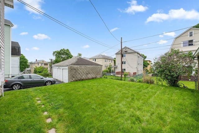 174 Vernon St, Worcester, MA 01610 - view of yard featuring a detached garage, a residential view, and an outdoor structure