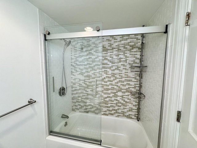 full bathroom featuring combined bath / shower with glass door