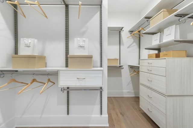 walk in closet featuring light wood-type flooring