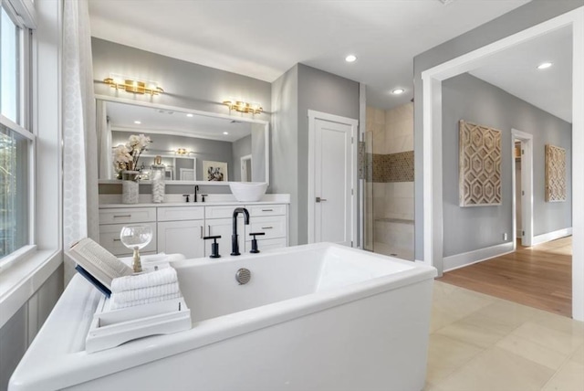 10 Old County Rd Unit 19, Hudson, MA 01749 - full bathroom featuring a freestanding bath, tiled shower, vanity, and recessed lighting
