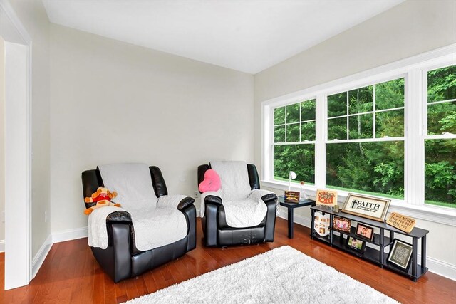 131 Rogerson Xing Unit 131, Uxbridge, MA 01569 - sitting room featuring baseboards and wood finished floors