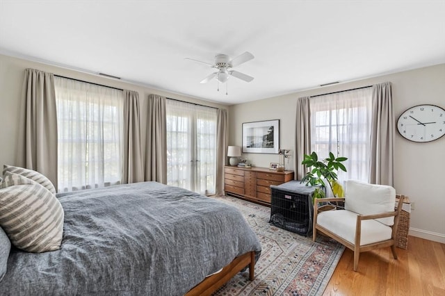 2 Hawthorne Blvd Unit 4, Salem, MA 01970 - bedroom with multiple windows, light wood-style floors, and a ceiling fan