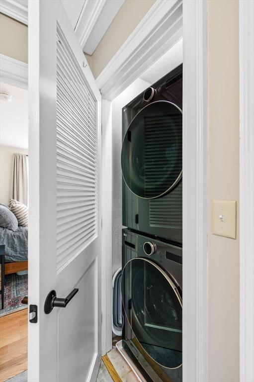 2 Hawthorne Blvd Unit 4, Salem, MA 01970 - washroom featuring stacked washer / drying machine and wood finished floors