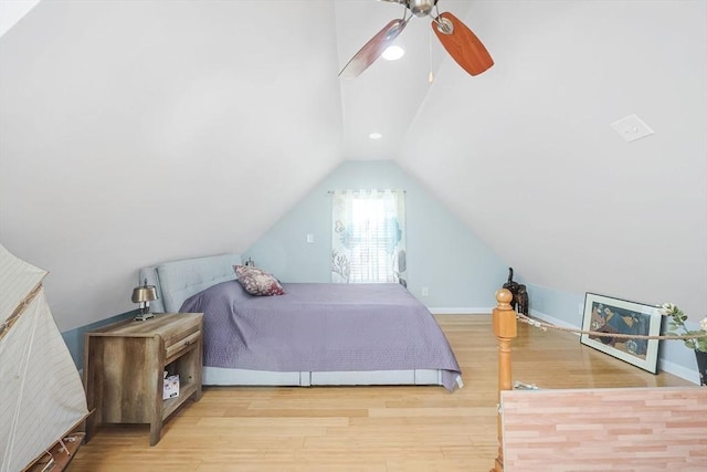 bedroom featuring vaulted ceiling, wood finished floors, a ceiling fan, and baseboards