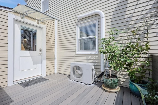 wooden deck with a cooling unit