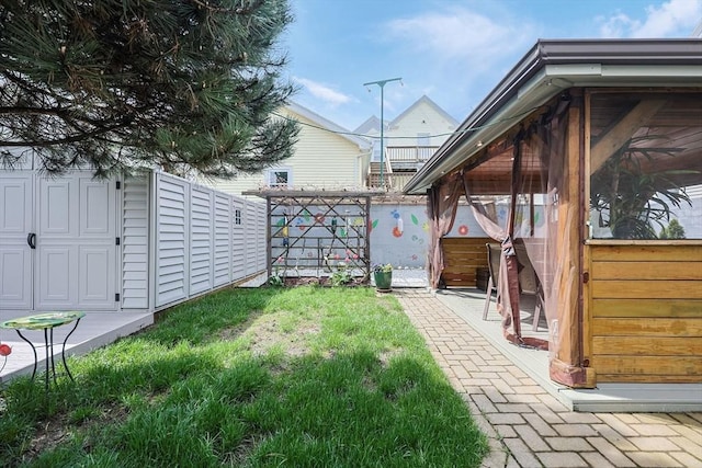 view of yard featuring a sunroom
