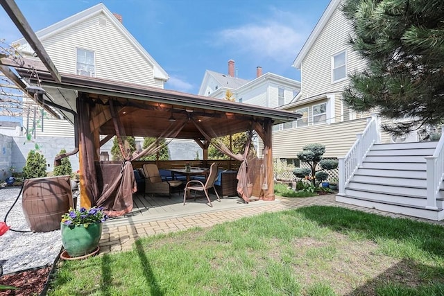 view of yard featuring a gazebo and a ceiling fan