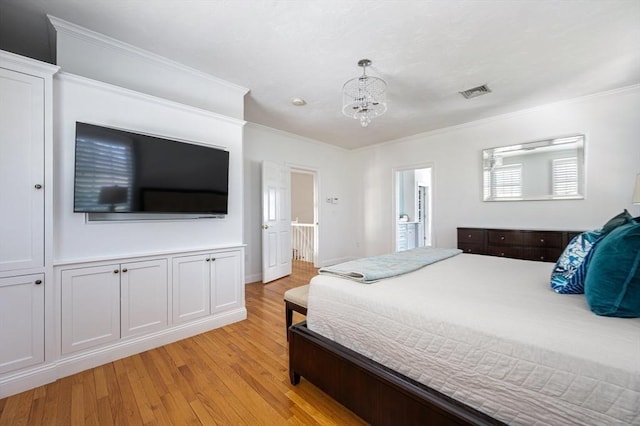 bedroom with light wood-type flooring, visible vents, crown molding, and a notable chandelier