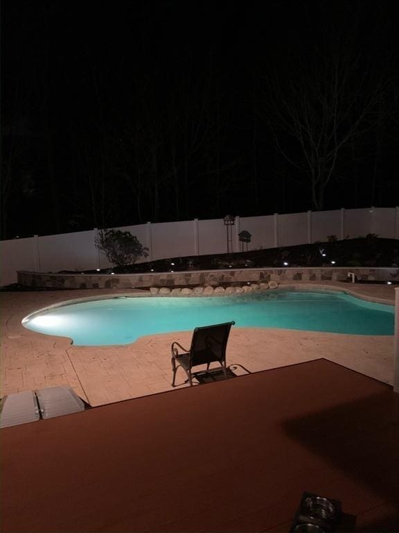 view of pool featuring a patio area, a fenced backyard, and a fenced in pool