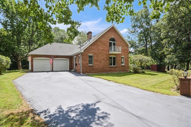 view of front of home with a garage and a front yard