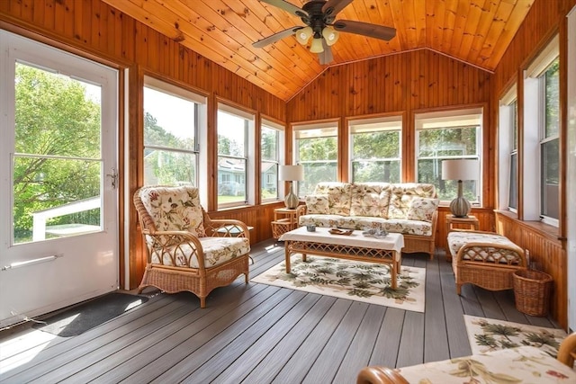 sunroom / solarium with vaulted ceiling, wooden ceiling, and ceiling fan