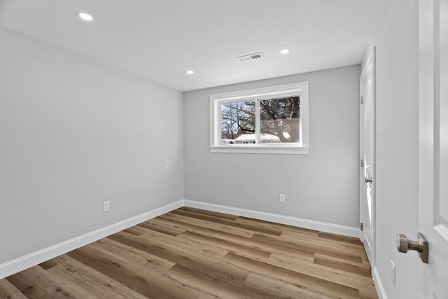 spare room with light hardwood / wood-style floors