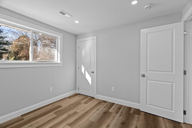 unfurnished bedroom with light hardwood / wood-style floors