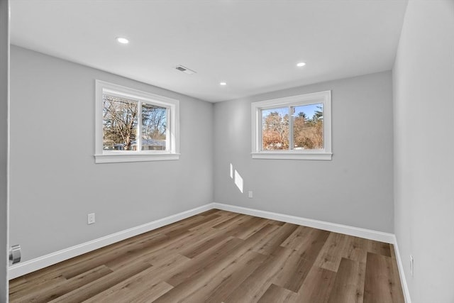 spare room with light hardwood / wood-style floors