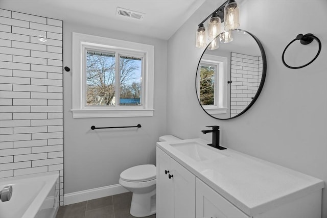 full bathroom featuring tile patterned flooring, vanity, a healthy amount of sunlight, and toilet