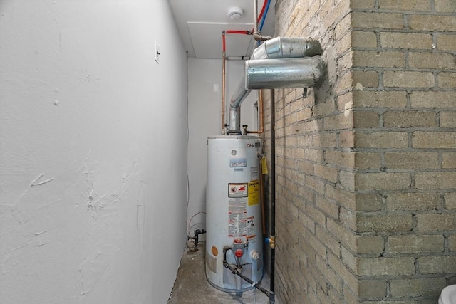 utility room with gas water heater