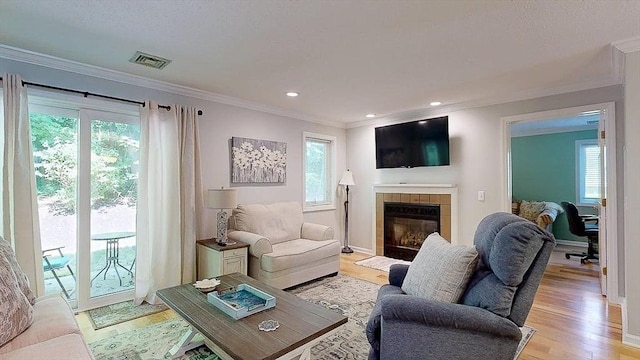 3 Oakwood Ln Unit 3, Worcester, MA 01604 - living area featuring ornamental molding, a tile fireplace, light wood-type flooring, and recessed lighting