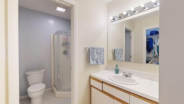 3 Oakwood Ln Unit 3, Worcester, MA 01604 - bathroom with a shower stall, vanity, tile patterned flooring, and a spacious closet