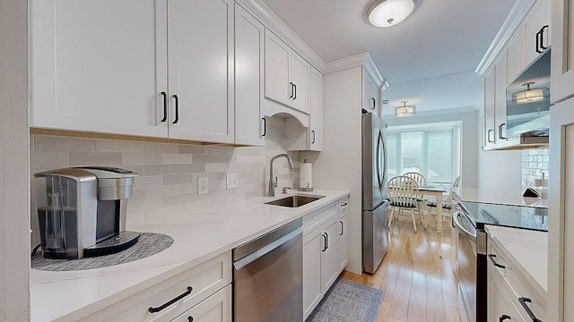 3 Oakwood Ln Unit 3, Worcester, MA 01604 - kitchen with appliances with stainless steel finishes, light wood-style floors, white cabinetry, decorative backsplash, and light countertops