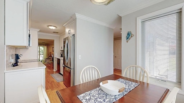 3 Oakwood Ln Unit 3, Worcester, MA 01604 - dining space featuring light wood-style floors and crown molding