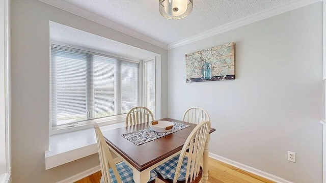 3 Oakwood Ln Unit 3, Worcester, MA 01604 - dining room featuring crown molding, light wood-style flooring, and a textured ceiling