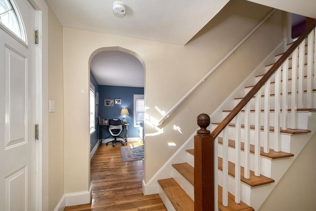 stairs featuring hardwood / wood-style flooring