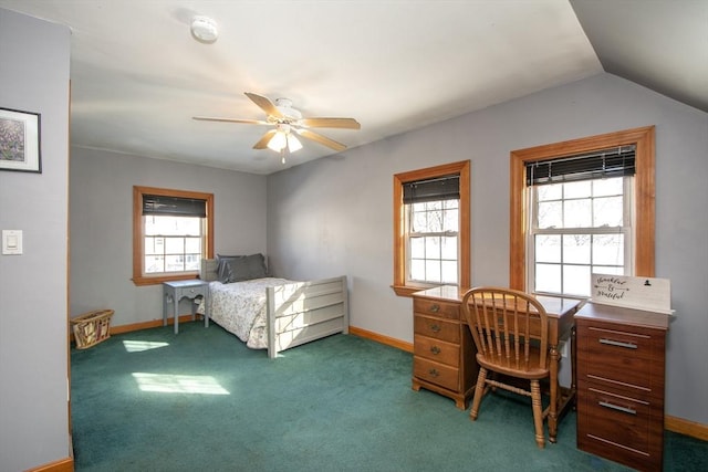 carpeted bedroom featuring ceiling fan, multiple windows, and lofted ceiling