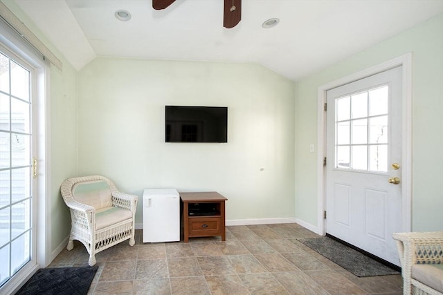 interior space with vaulted ceiling and ceiling fan