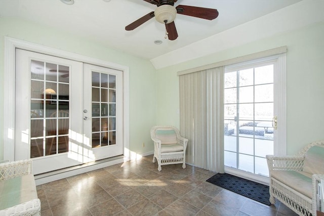 doorway to outside featuring ceiling fan, french doors, and lofted ceiling