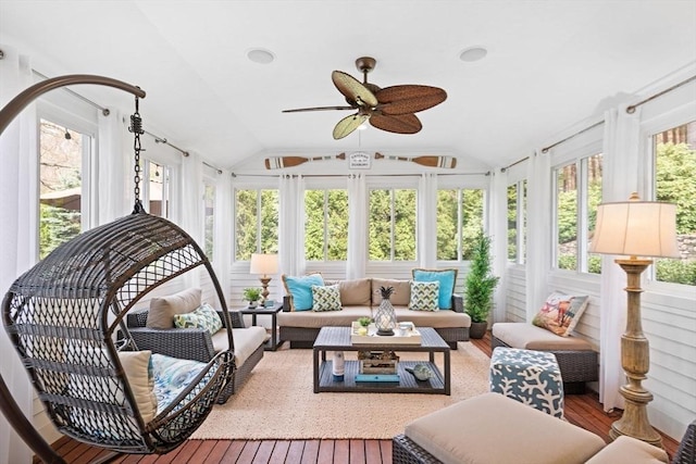 sunroom / solarium featuring an outdoor living space, a ceiling fan, vaulted ceiling, and hardwood / wood-style flooring