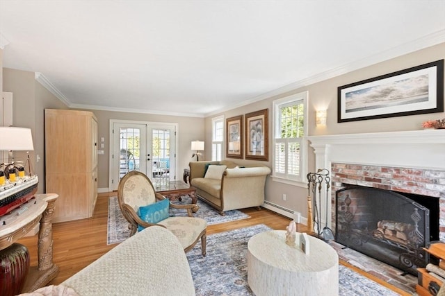 living room with french doors, ornamental molding, and wood finished floors