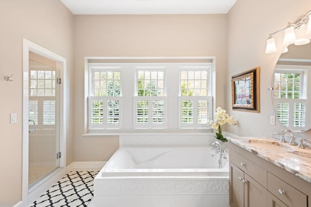 full bath featuring plenty of natural light and a garden tub