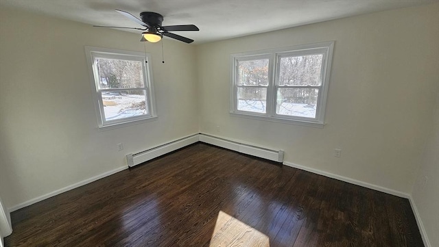 unfurnished room with baseboard heating, dark wood finished floors, a ceiling fan, and baseboards