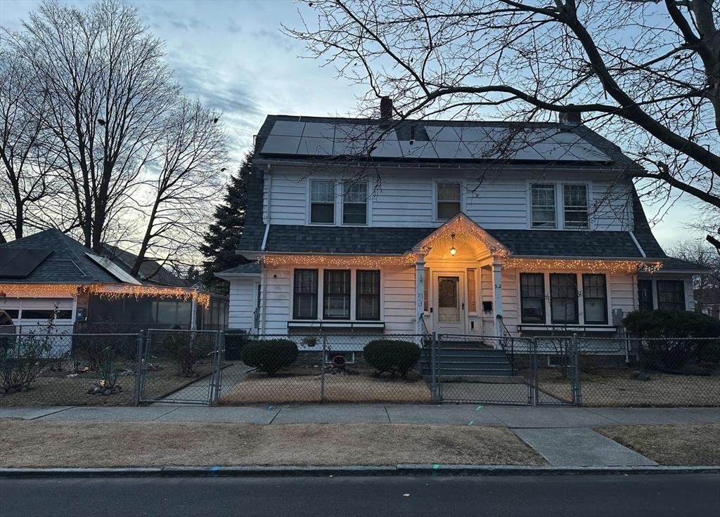 view of front of home featuring solar panels