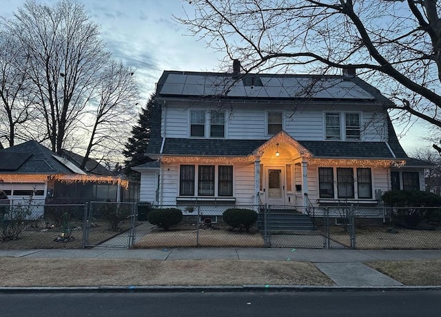 view of front of home featuring solar panels