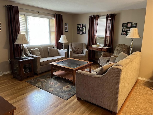 48 Birchcroft, Leominster, MA 01453 - living area with healthy amount of natural light, light wood-style floors, and cooling unit