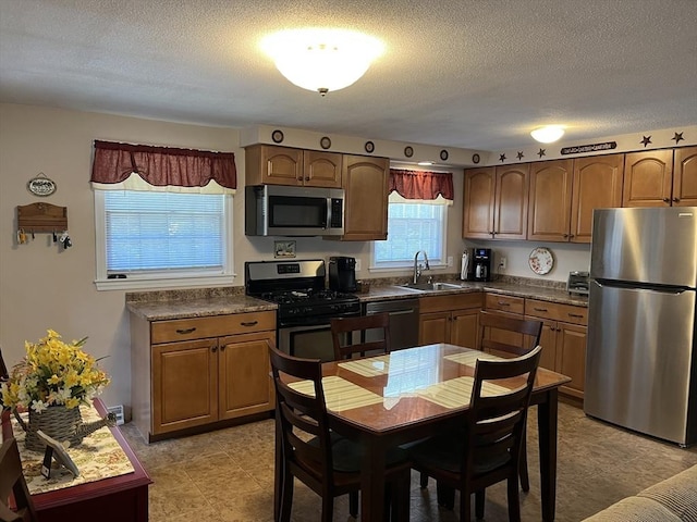 48 Birchcroft, Leominster, MA 01453 - kitchen with appliances with stainless steel finishes, a textured ceiling, and dark countertops